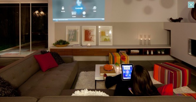 All functions in the house can be controlled by an iPhone or an iPad from anyplace on earth with an internet connection.