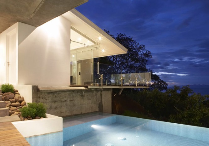 An infinity pool seems to further connects the house to the ocean just below.