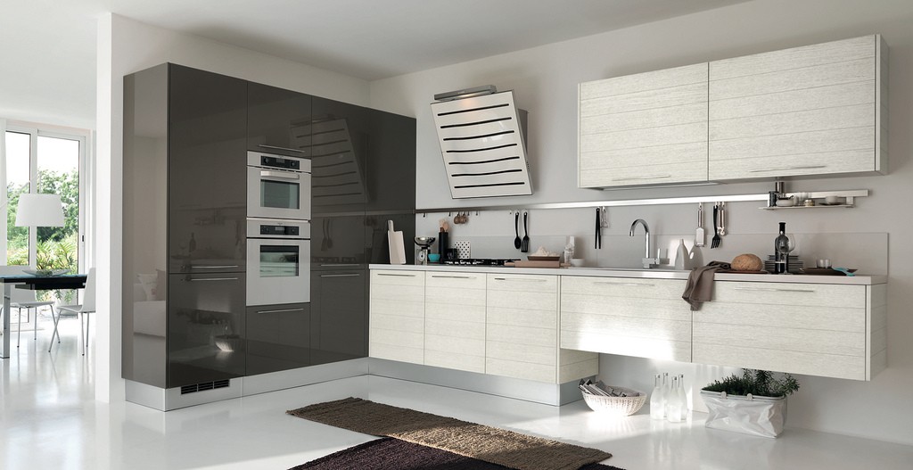 grey and white kitchen10 This brown and white kitchen is nicely understated. Instead of additional shelves or cabinetry, the design is further simplified by attaching a single rack that lines the wall above the sink, and open "storage" space underneath part of the counter area.