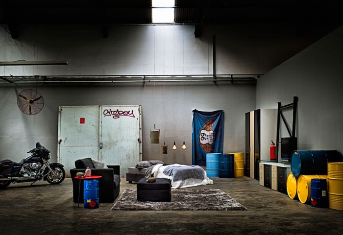 We see the unimposing pieces hugging the perimeter of industrial garage spaces and beach shack staging, an unusual approach for bedroom furniture but intriguing nonetheless.