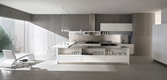 An ice white layout gives a clean visual, and these handleless cupboards work towards a sleek, fuss-free finish.