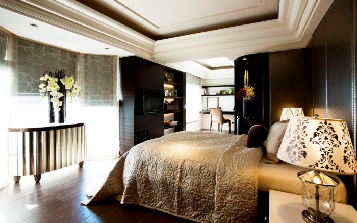 The master bedroom is a sumptuous scheme full of rich hues and plush comfort.