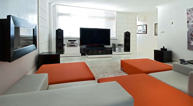 For the nerd within all of us, the setup features kit from various manufacturers, including:
Pioneer PDP-LX608D; Kef Ref's 205/2, 204/2C, 201/2, and XQ10's (all piano black); 2 x JL Audio Fathom F112's.(piano black); Denon 3800BD, 4308 (as processor); DCD700AE; Rotel 1575 & 1562; PS3 & Wii; Sky HD; Harmony 1000 (RF extender); Z-Wave & X-10 lighting; Chord Odyssey 4 cable, QED HDMI's, inter's & opticals.