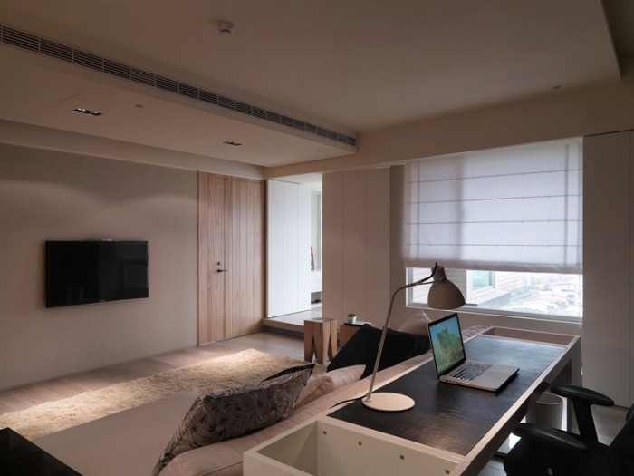 The placement of this home work area allows the desk to be out of sight and out of mind whilst relaxing on the sofa at the end of a tough day, but also allows the workplace to a part of the room when in use, and even enables a clear view of the television.