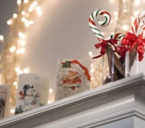 Christmas cards become charming mantel décor along with a simple white lighted wreath.