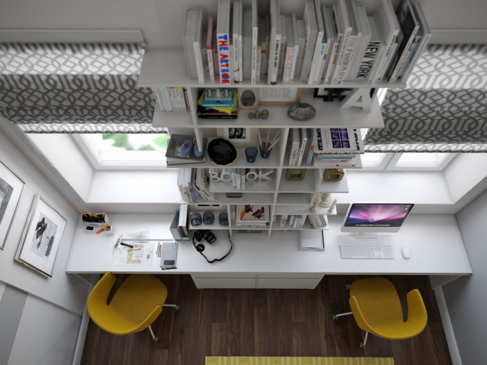 This dynamic loft workspace packs a lot into a tiny amount of square footage by taking the space soaring upwards with dramatically tall bookshelves and huge windows.