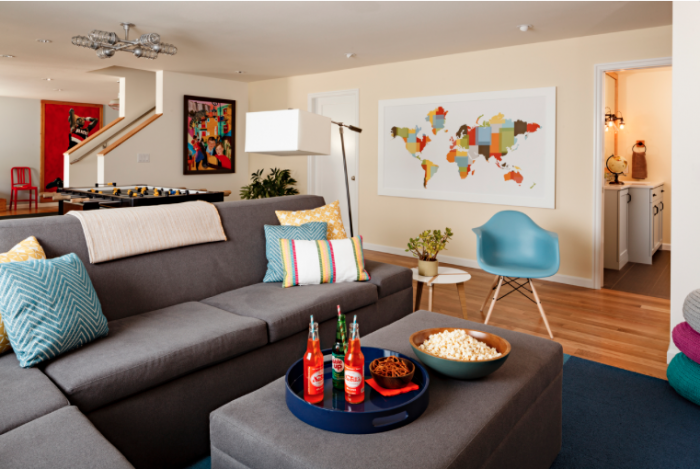 Vibrant pops of color bring this basement living space to life.