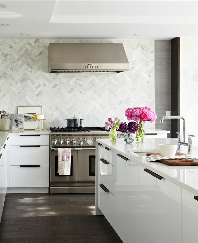 The chevron pattern creates a marble backsplash with personality and French charm.