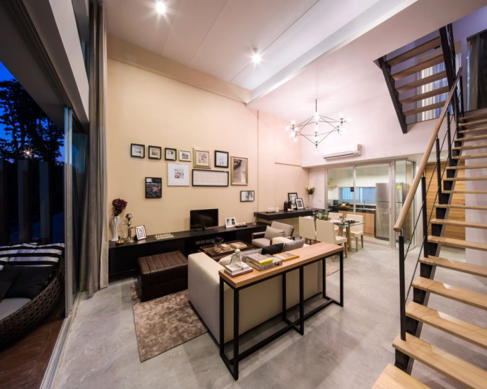 The kitchen is seen from this vantage point with its glass enclosure that opens or closes as desired.