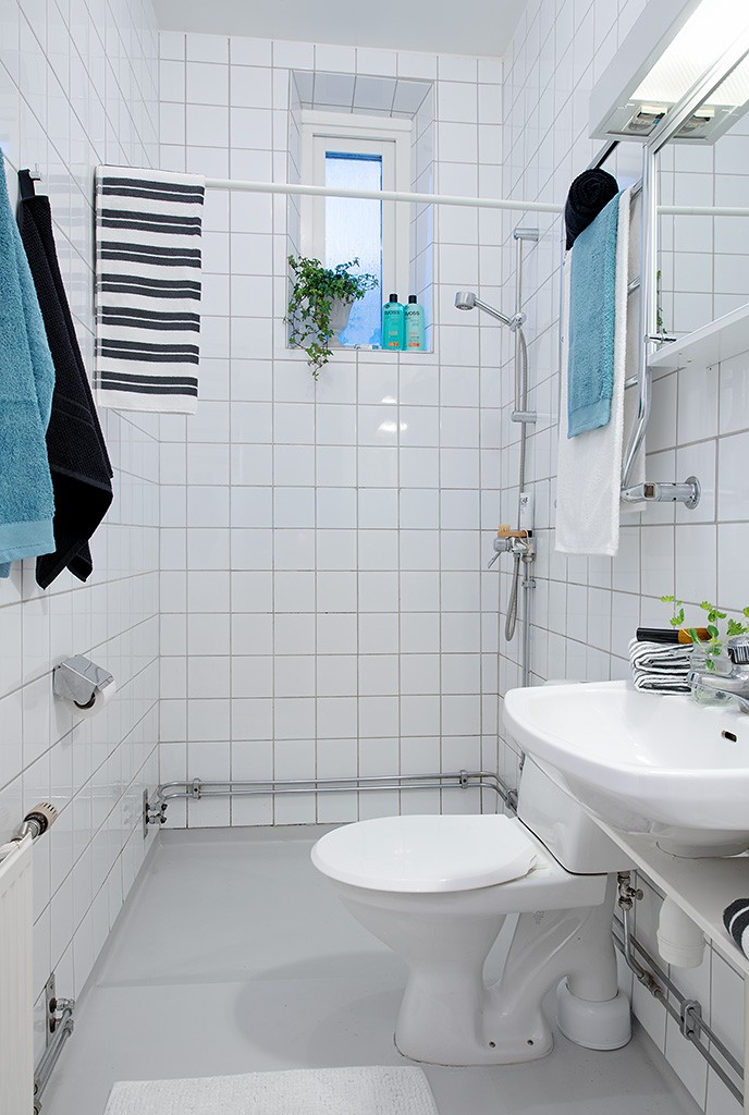 white tile shower surround