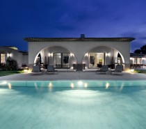 arched pool house at night