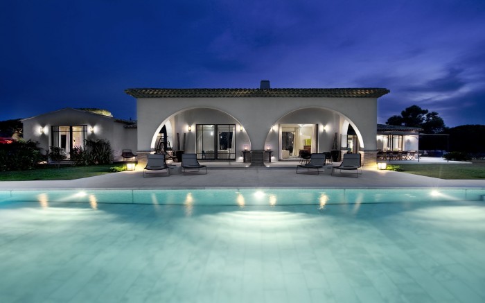 arched pool house at night