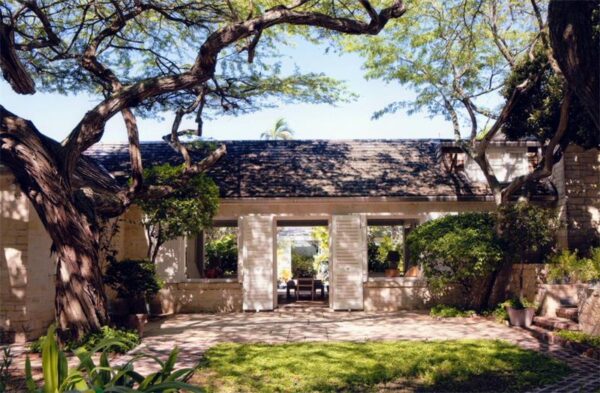 English colonial plantation shutters shady trees