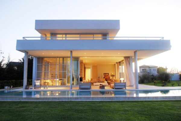 Exterior Modern White Agua House at dusk