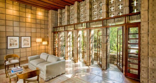 Frank Lloyd Wright Millard House high ceiling living doors to terrace