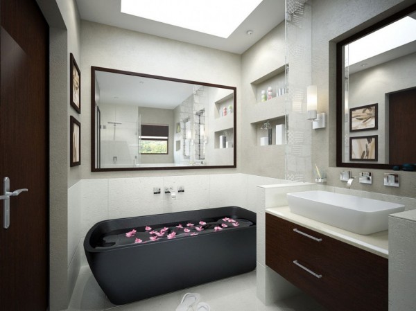 Monochrome bathroom with black tub and mirrors