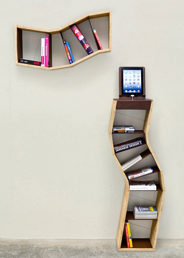 Though the contrast between ancient leather-bound literature and semi-industrial, modern shelving makes for an intriguing combination, shelving such as that which is displayed here, can be repurposed to accommodate all manner of things, not least of which are CDs and DVDs. It lends itself to those objects that are lightweight, but given the increasing computerization of study, there is no reason as to why stylish display choices such as these could not meet the demands of a university student, be adapted to the room of an adolescent, or even, inhabit an office.