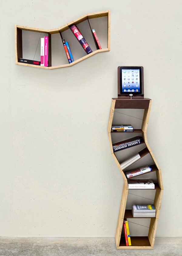 Though the contrast between ancient leather-bound literature and semi-industrial, modern shelving makes for an intriguing combination, shelving such as that which is displayed here, can be repurposed to accommodate all manner of things, not least of which are CDs and DVDs. It lends itself to those objects that are lightweight, but given the increasing computerization of study, there is no reason as to why stylish display choices such as these could not meet the demands of a university student, be adapted to the room of an adolescent, or even, inhabit an office.