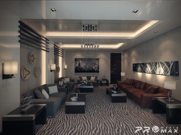 Masculine furnishings and bold pattern dominate this large open apartment living space.  Architectural elements on the walls and ceiling provide additional interest to the space.