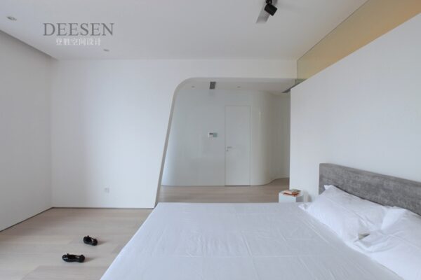 bedroom white with natural headboard and sleek white lines