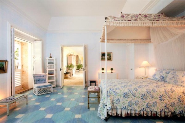 four poster blue and white bed geometric floors