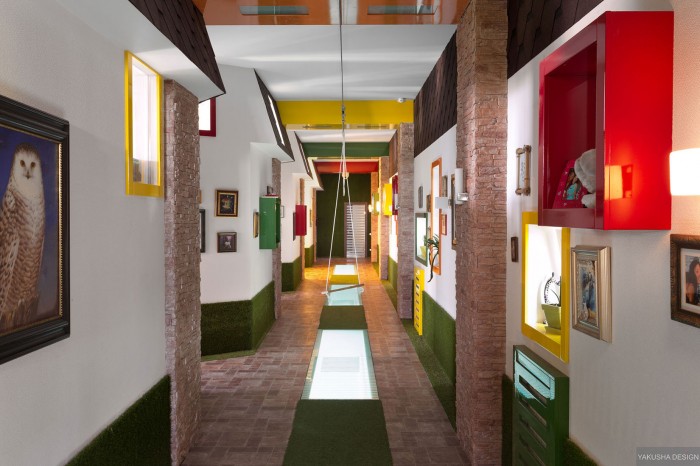 fun hallway in primary colors with swing and brick borders