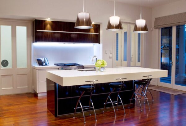 This kitchen is not lacking for natural lighting as it seems to be streaming in from windows and doors on every side.