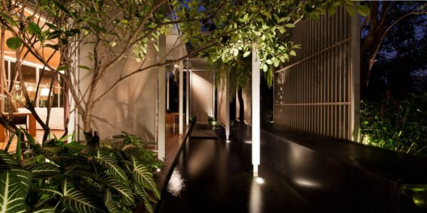 An internal sleek, brilliantly lit passageway boasts access to the home's interior spaces on every side.