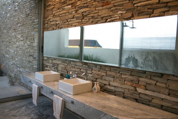natural bathroom with twin sinks in stone