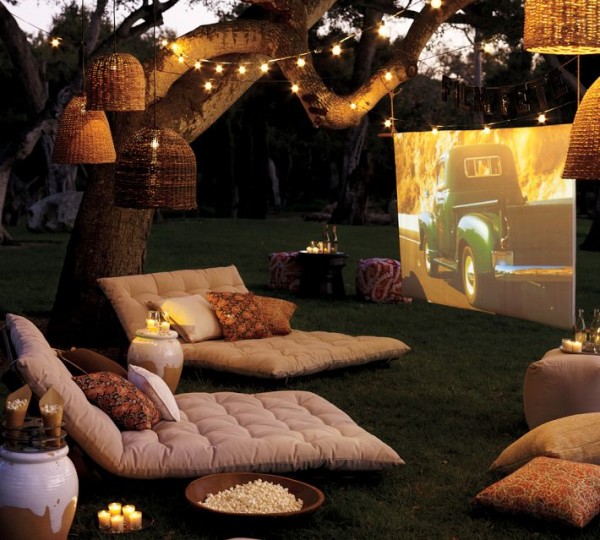 outdoor cinema with soft furishings and tree lighting