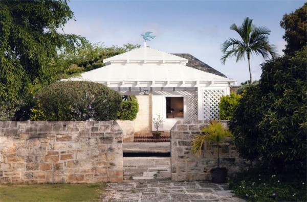 plantation style house stone garden wall