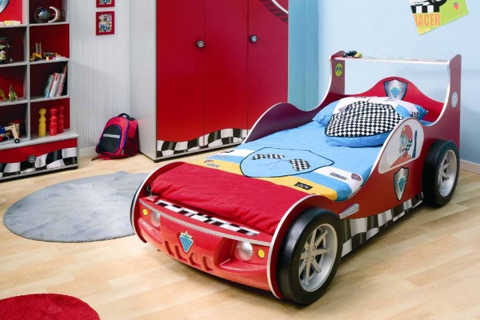 race car themed boys room in blue and red with storage