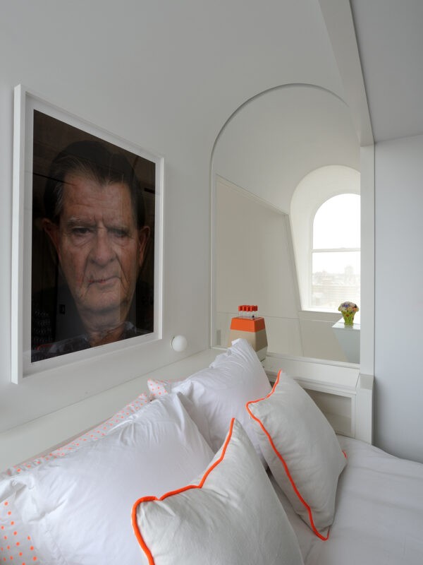 Bedroom higher floors in white and neon with portrait