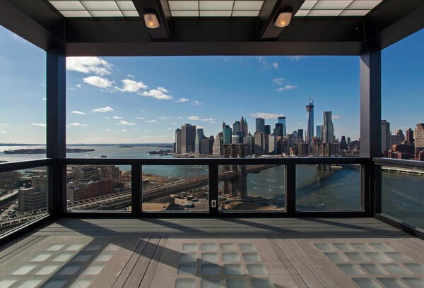Clock Tower Apartment- covered rooftop with views of New York CIty