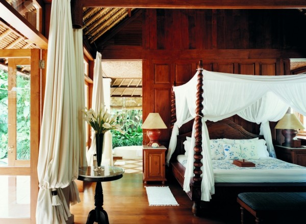 Como Shambhala Estate Bali- four poster bedroom in wood with views