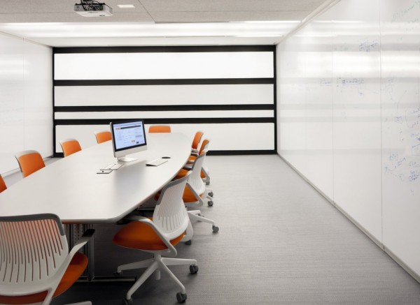 Kayak Startup Tech Office- flood lit linear conference room in white and orange