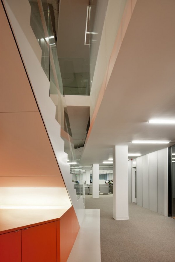 Kayak Startup Tech Office- glass panelled staircase with orange and white color scheme