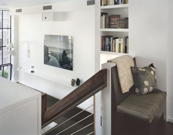 Pulltab Design- cleverly stored books with reading nook atop staircase Pulltab Design- cleverly stored books with reading nook atop staircase