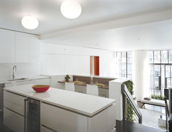 Pulltab Design- glossy white kitchen top level with view to naturally lit lounge