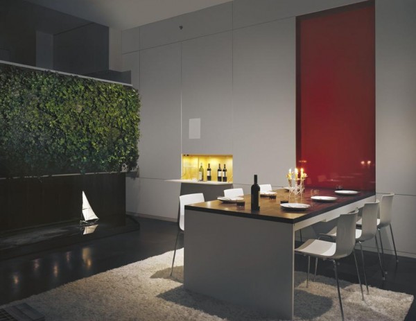 Pulltab Design- red pannelled high gloss dining area with water feature and green wall
