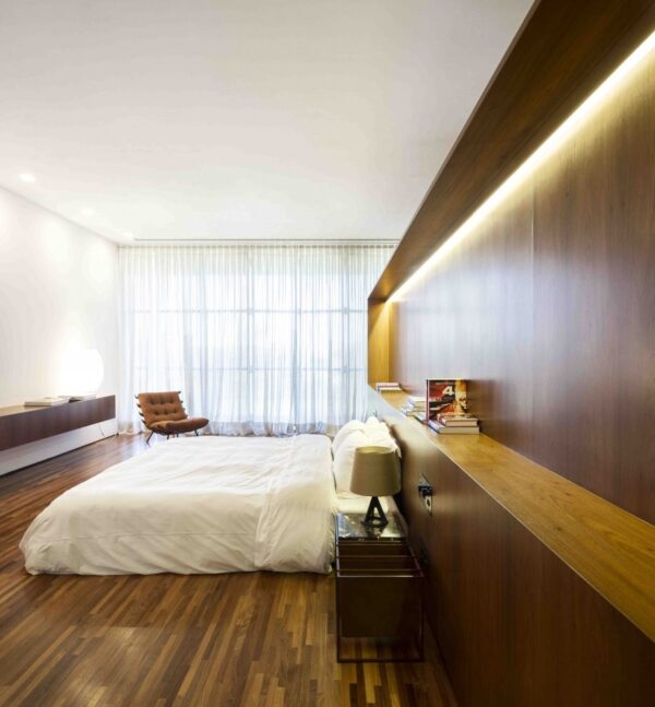 Marcio Kogan's Casa Lee Concrete House- bedroom with wood cladding and flooring