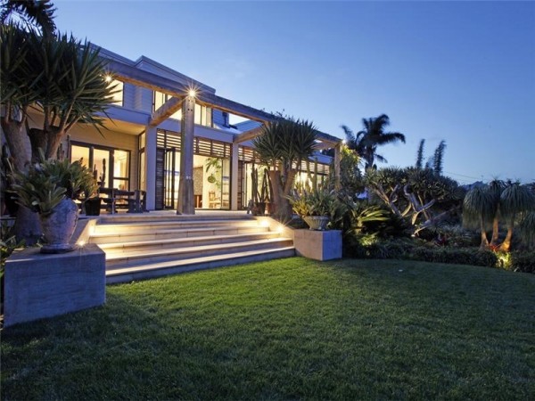Sotheby's Auckland House- rear entrace to house from manicured lawn and tropical gardens