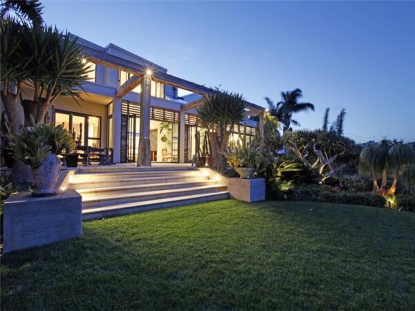 Sotheby's Auckland House- rear entrace to house from manicured lawn and tropical gardens