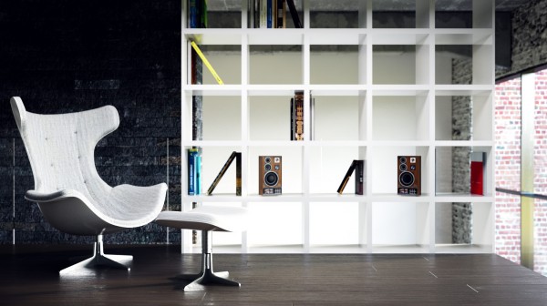 An unique version of Arne Jacobsen's iconic Egg Chair and Ottoman take center stage next to a grid-designed bookcase.