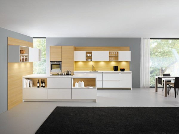 white kitchen units with wooden cladding