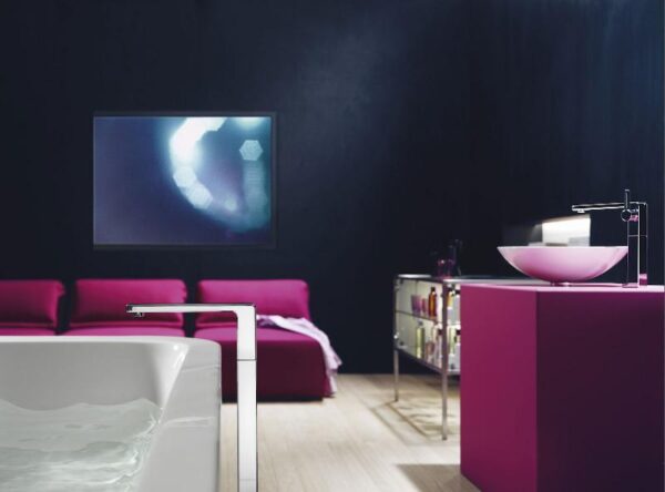 Gorgeous fuchsia occasional chairs and matching vanity add a glamorous feel to this modern bath.