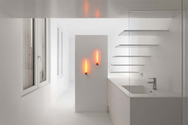 Two low pressure sodium lamps with zero CRI emit warm light in the bath's vanity area.