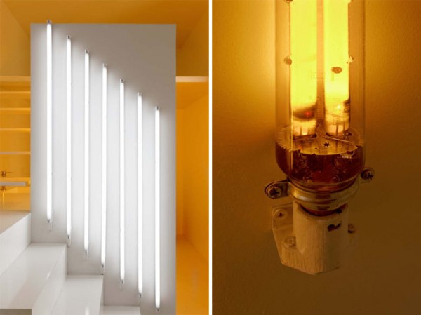 This detail shows two light spectrums, cool and warm, from two different types of bulbs. From kitchen to bathroom at the far end, the lights create a color blocked effect.