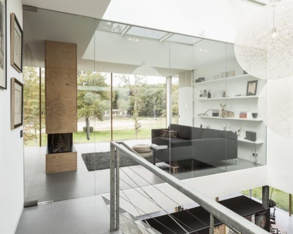 Glass walls in the villa's interior allow light to flow through the rooms from one side to another.