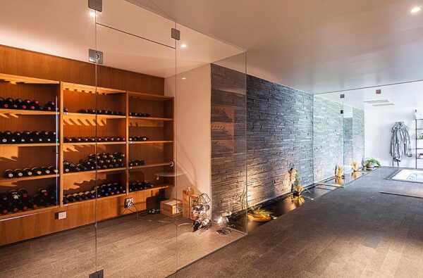 Modern Villa Interior Wine Room 1 A wine lover's dream, this winde room doesn't hide the wine away in a musty cellar but puts it on display in a glass enclosed room.